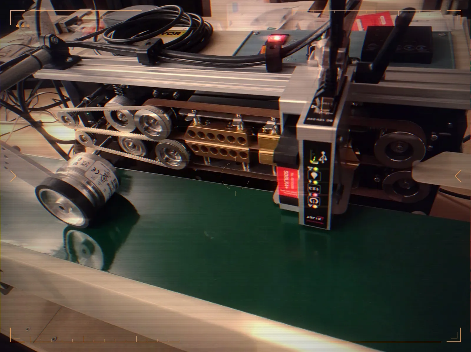 The production station with its conveyor belt on the factory floor